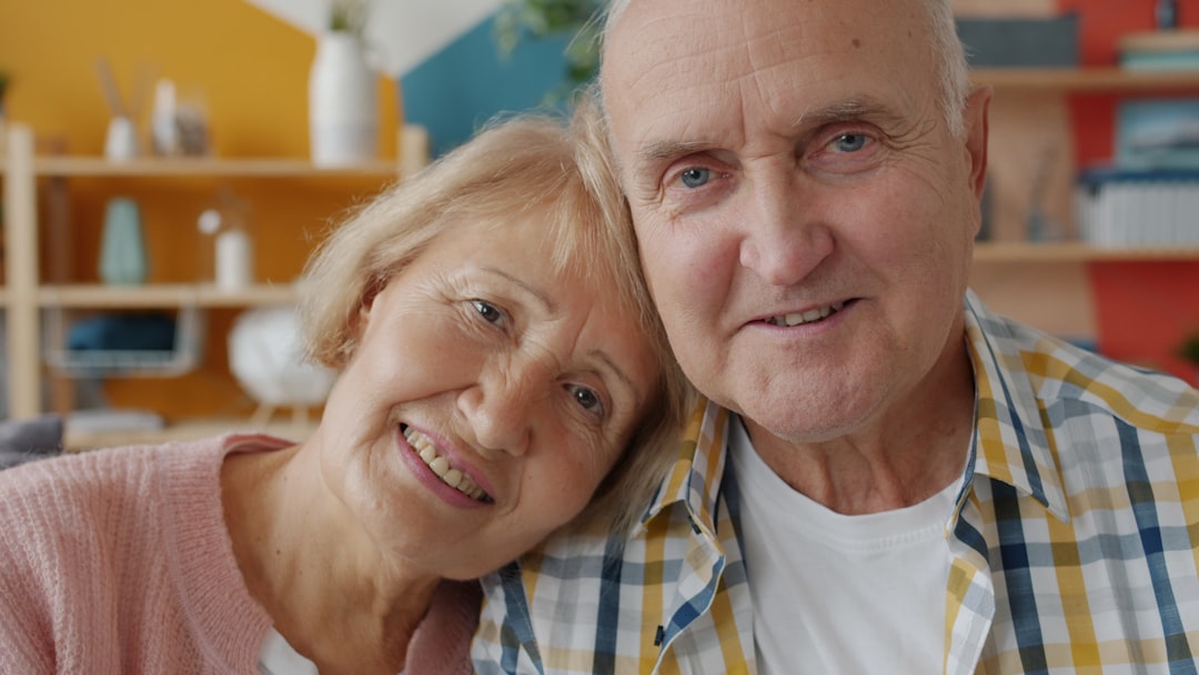 A smiling older couple at home together