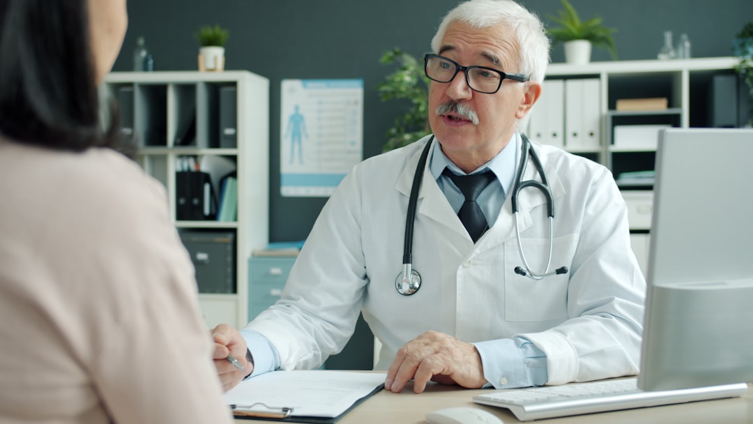 A doctor talking with a patient during a clinic appointment