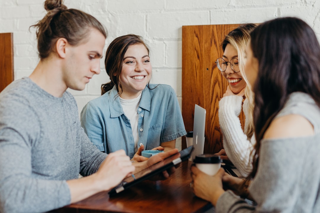 A group of friends talking together at a coffee shop