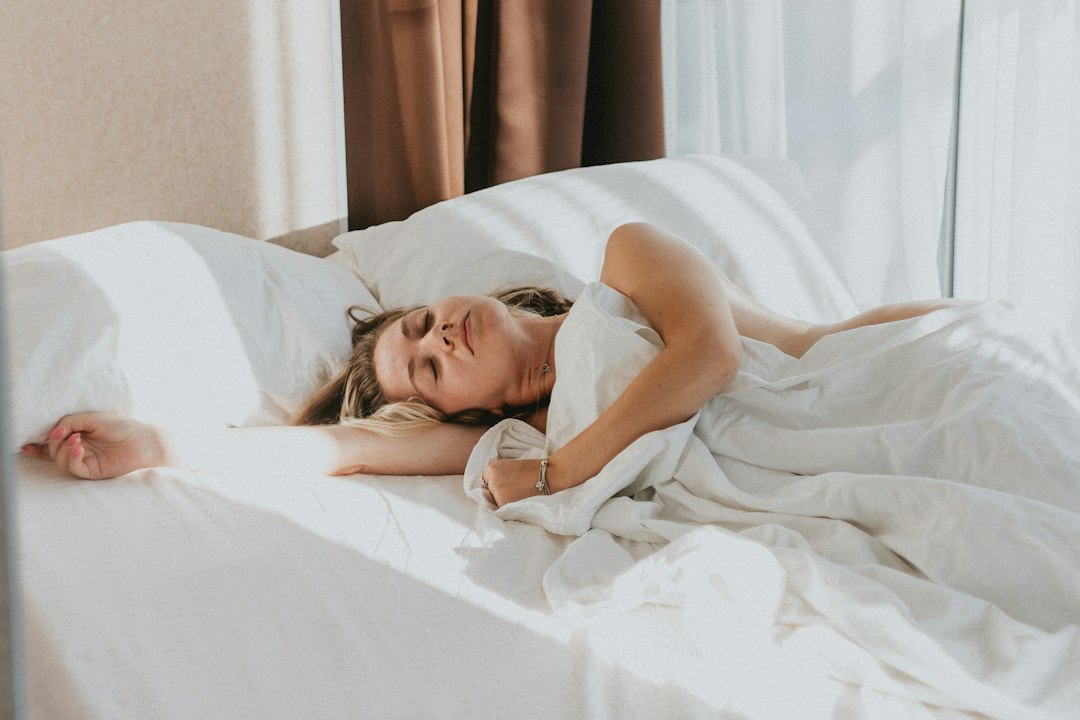 A person resting peacefully in bed
