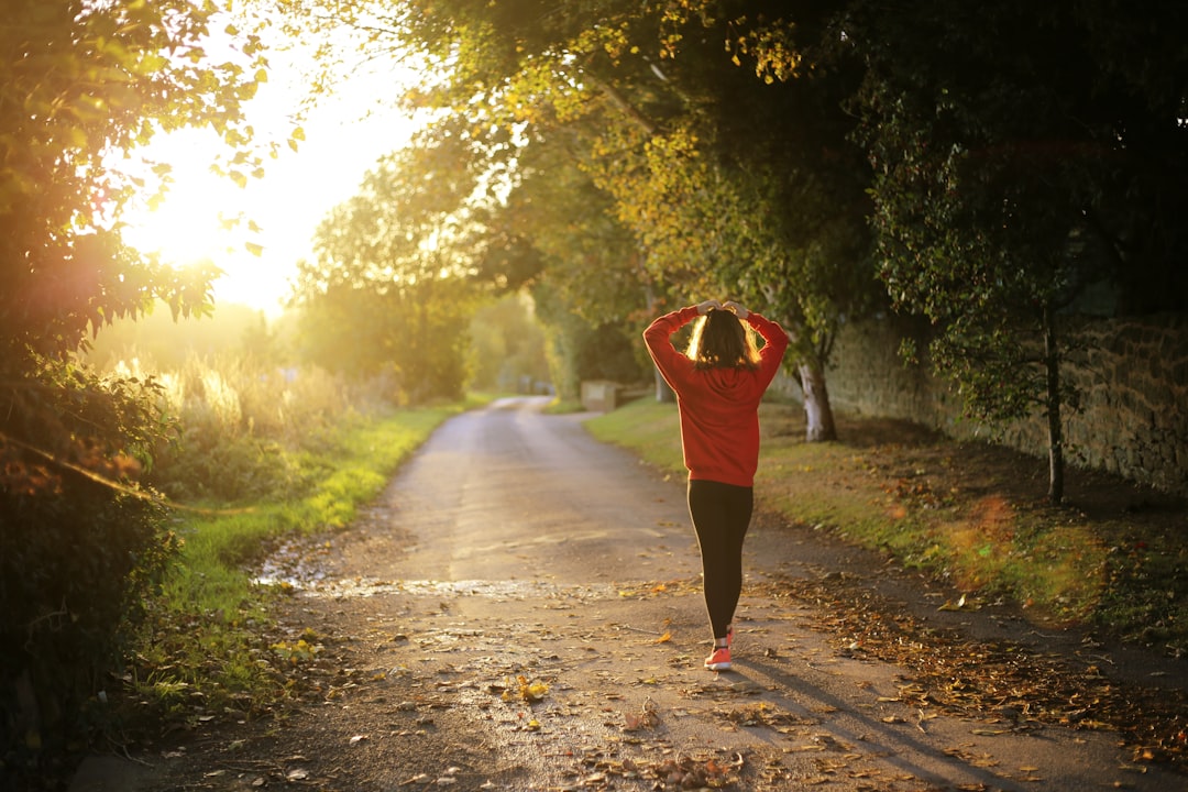 A woman walking on a pathway during the day