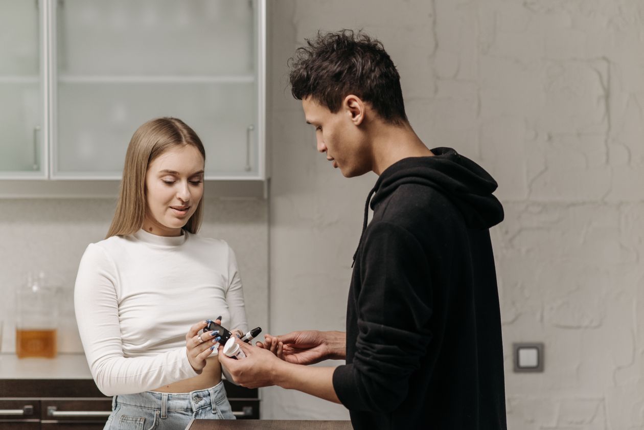 Person handing over a glucose meter