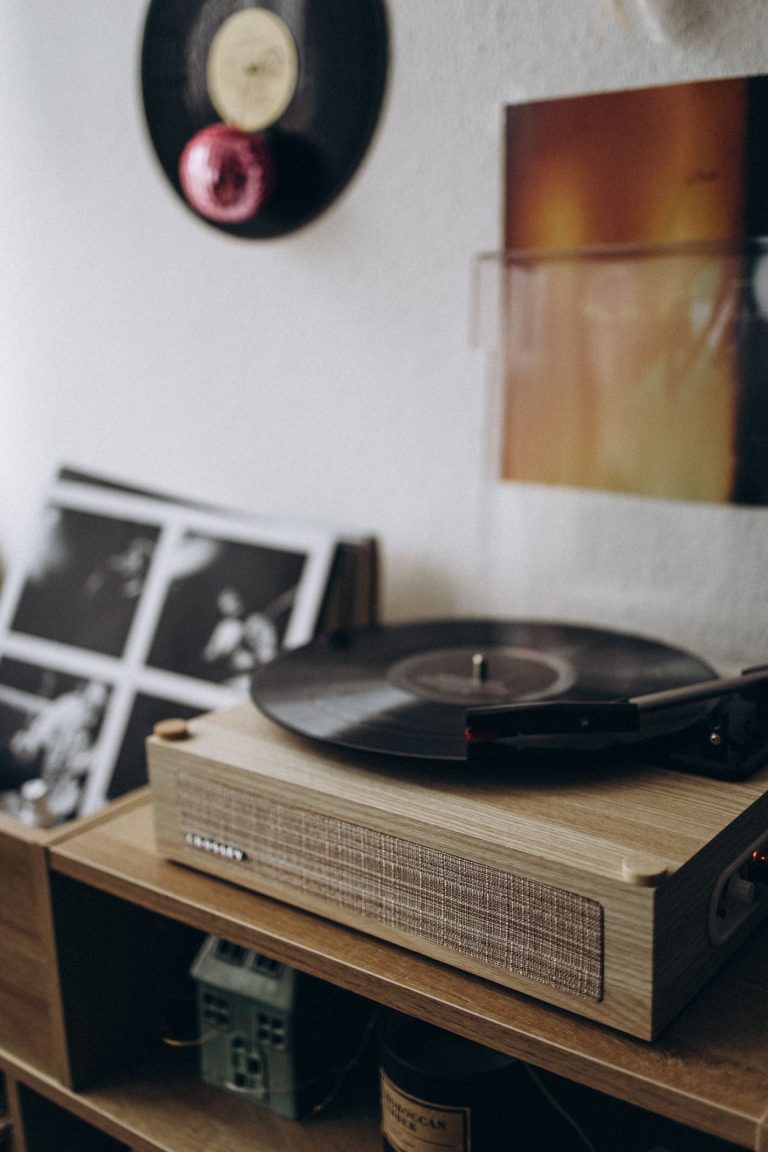 Vintage turntable playing a vinyl record in a cozy room